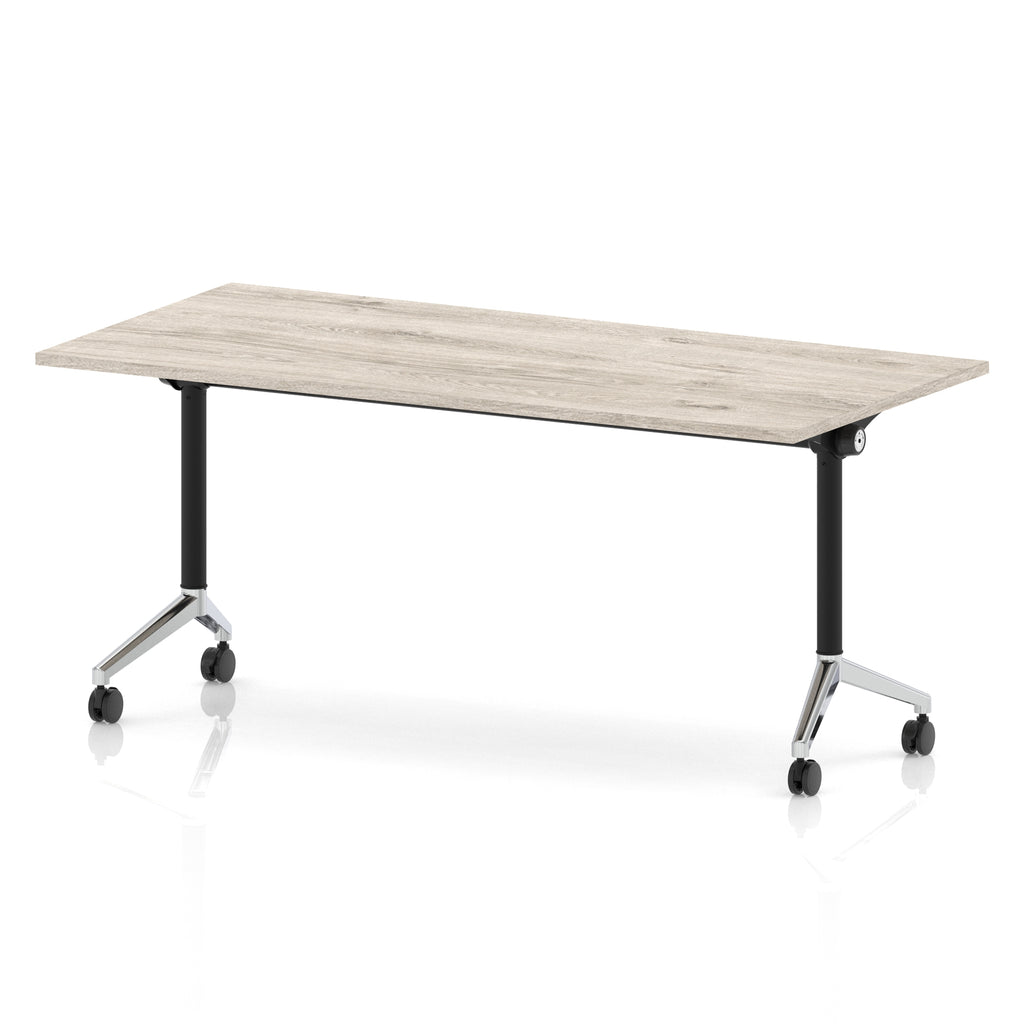 Rectangular table with a grey wood-effect flip top and black and chrome metal legs on wheels against a white background