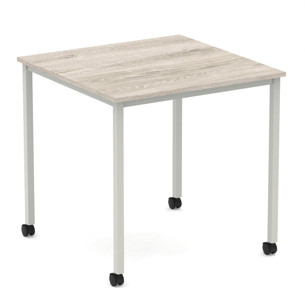 Square table with a wood-effect top and metal legs with castors on a white background