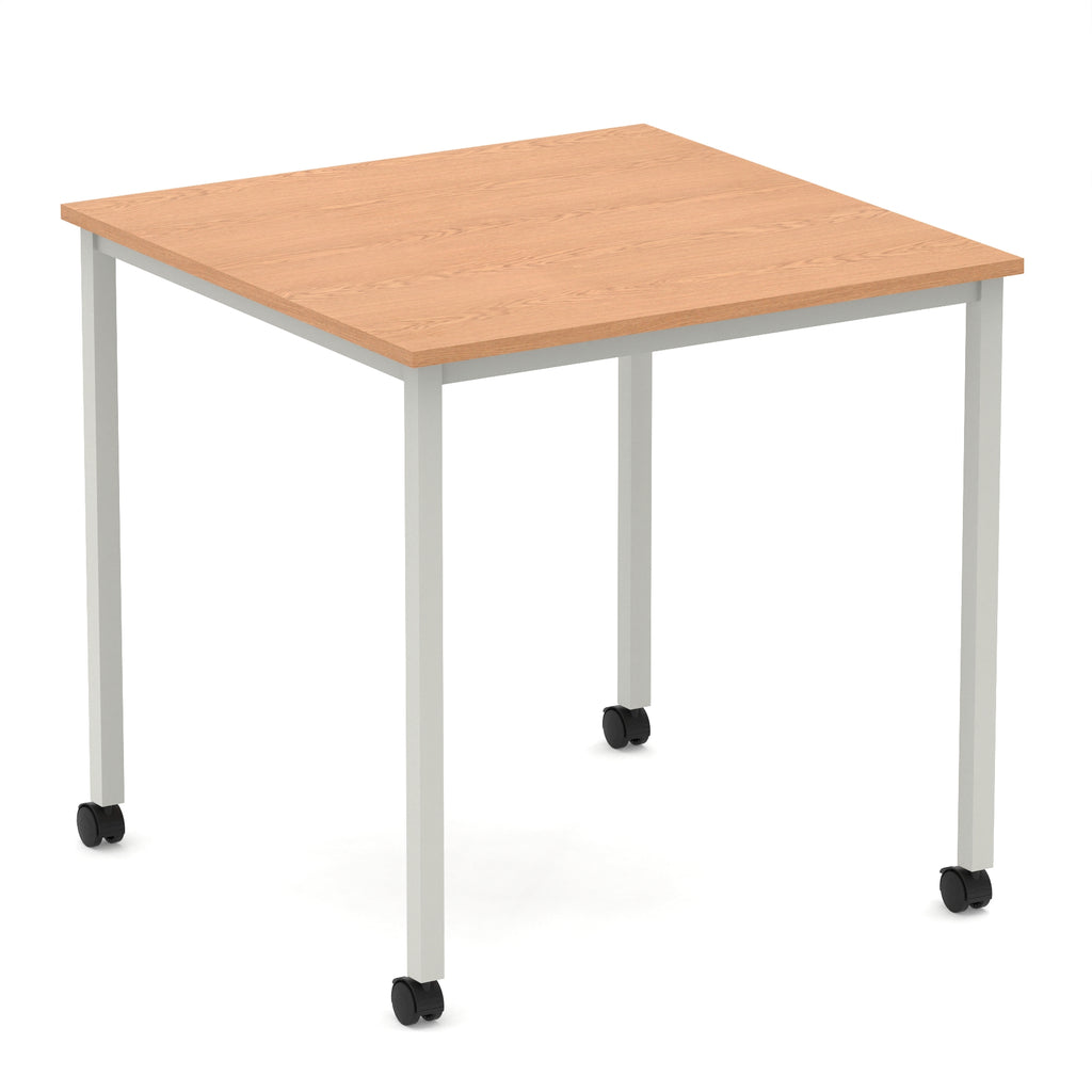 Square table with a wood-effect top and metal legs with castors on a white background