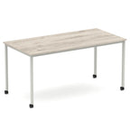 Rectangular table with a wood-effect top and metal legs with castors on a white background