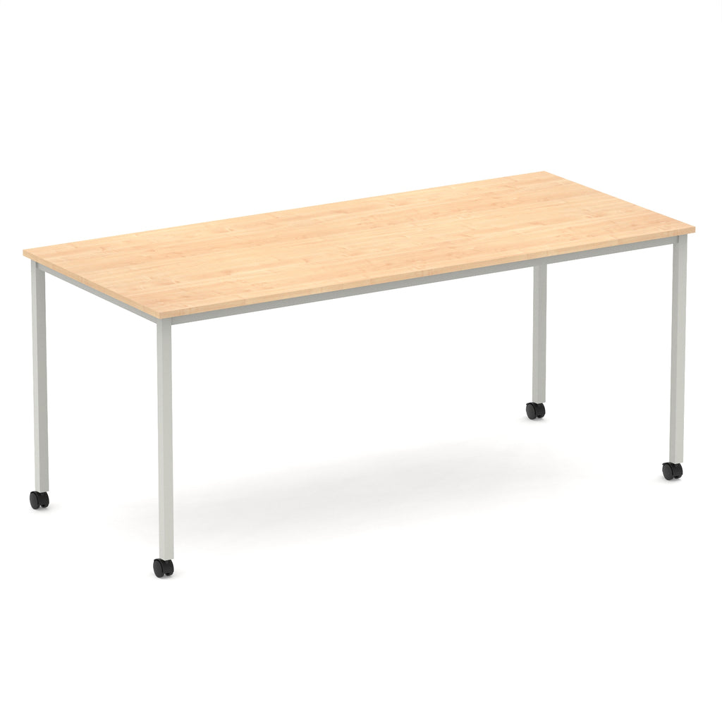Rectangular table with a wood-effect top and metal legs with castors on a white background