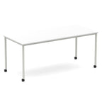 Rectangular table with a white top and metal legs with castors on a white background