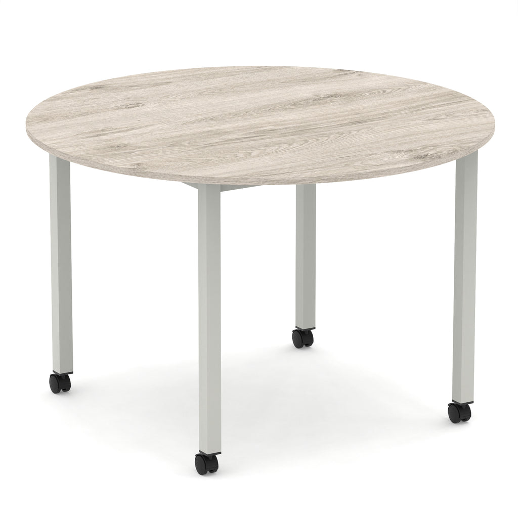 Round table with wood-effect top and metal legs with castors on a white background