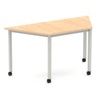 Trapezium shaped table with wood-effect top and metal frame with wheels, shown on a white background