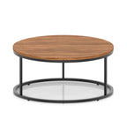 A round coffee table with a dark wood-effect top and a black metal frame, shown on a white background.