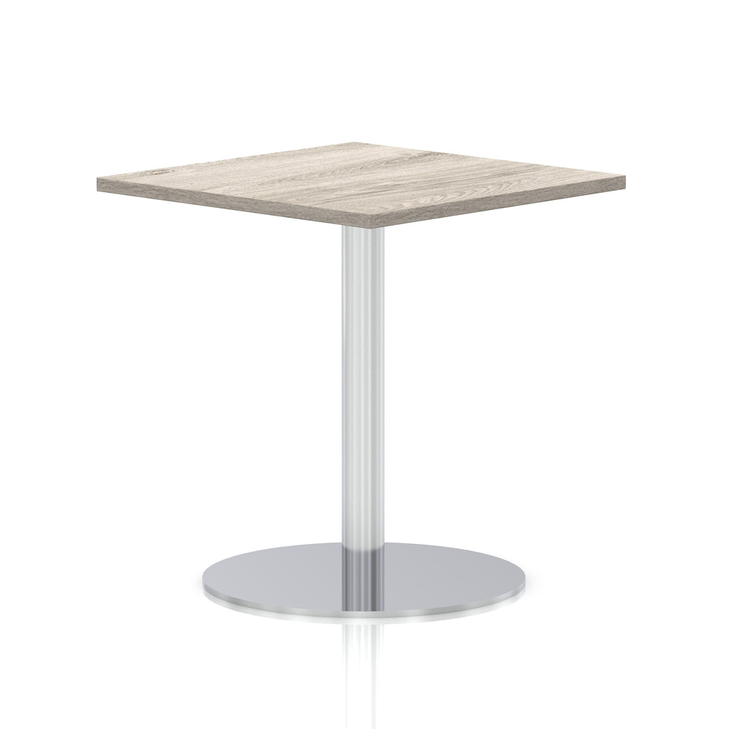Square table with a grey wood-effect top and silver cylindrical base on a white background