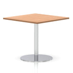 Square table with a wood-effect top and silver cylindrical base on a white background