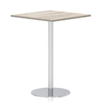 Square high table with a wood-effect top and silver cylindrical base on a white background