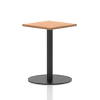 Square table with a wood-effect top and black cylindrical base on a white background