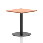 Square table with a wood-effect top and black cylindrical base on a white background