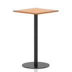 Square high table with a wood-effect top and black cylindrical base on a white background