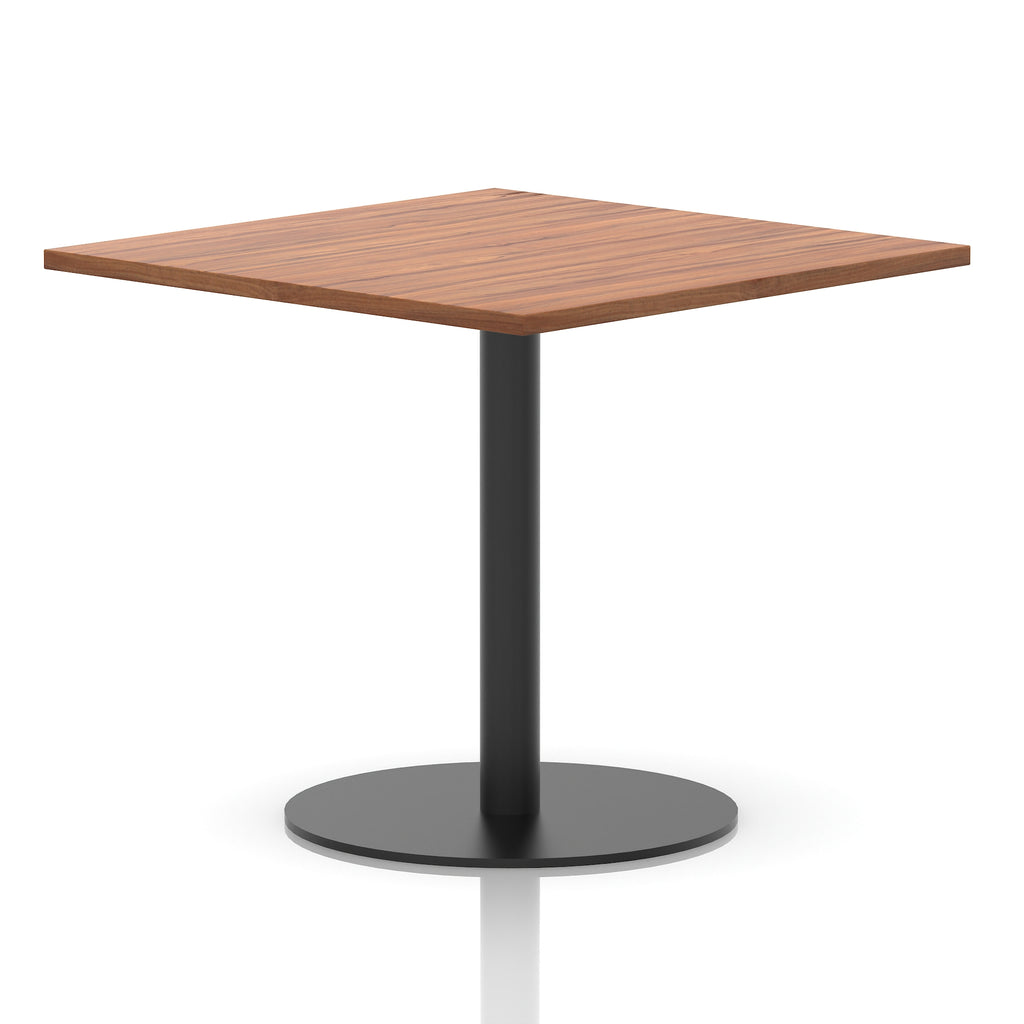Square table with a wood-effect top and black cylindrical base on a white background