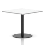 Square table with a white top and black cylindrical base on a white background