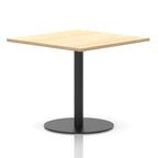 Square table with a wood-effect top and black cylindrical base on a white background