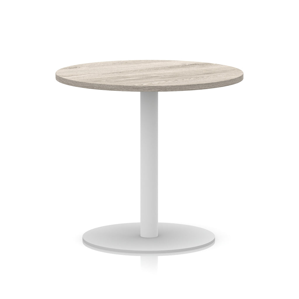 Round table with wood-effect top and white base on a white background