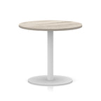 Round table with wood-effect top and white base on a white background