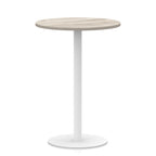 Round high table with wood-effect top and white base on a white background