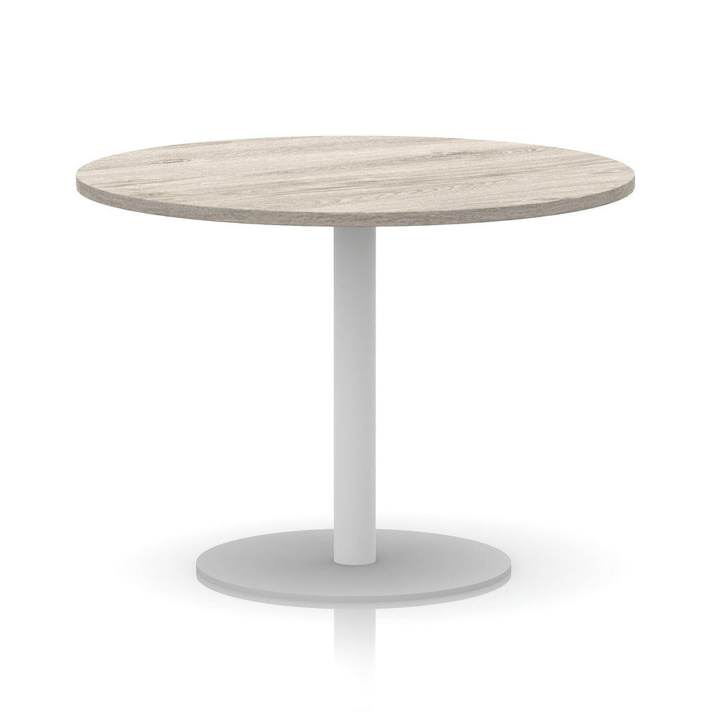 Round table with wood-effect top and white base on a white background