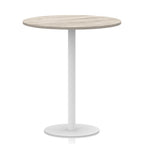 Round table with wood-effect top and white base on a white background