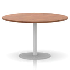 Round table with wood-effect top and white base on a white background