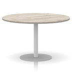 Round table with wood-effect top and white base on a white background