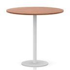 Round table with wood-effect top and white base on a white background