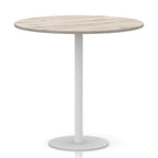 Round table with wood-effect top and white base on a white background