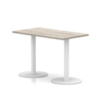 Rectangular table with wood-effect top and white legs on a white background