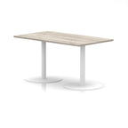 Rectangular table with wood-effect top and white legs on a white background