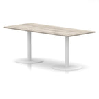 Rectangular table with wood-effect top and white legs on a white background