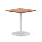 Square table with wood-effect top and white round base on a white background