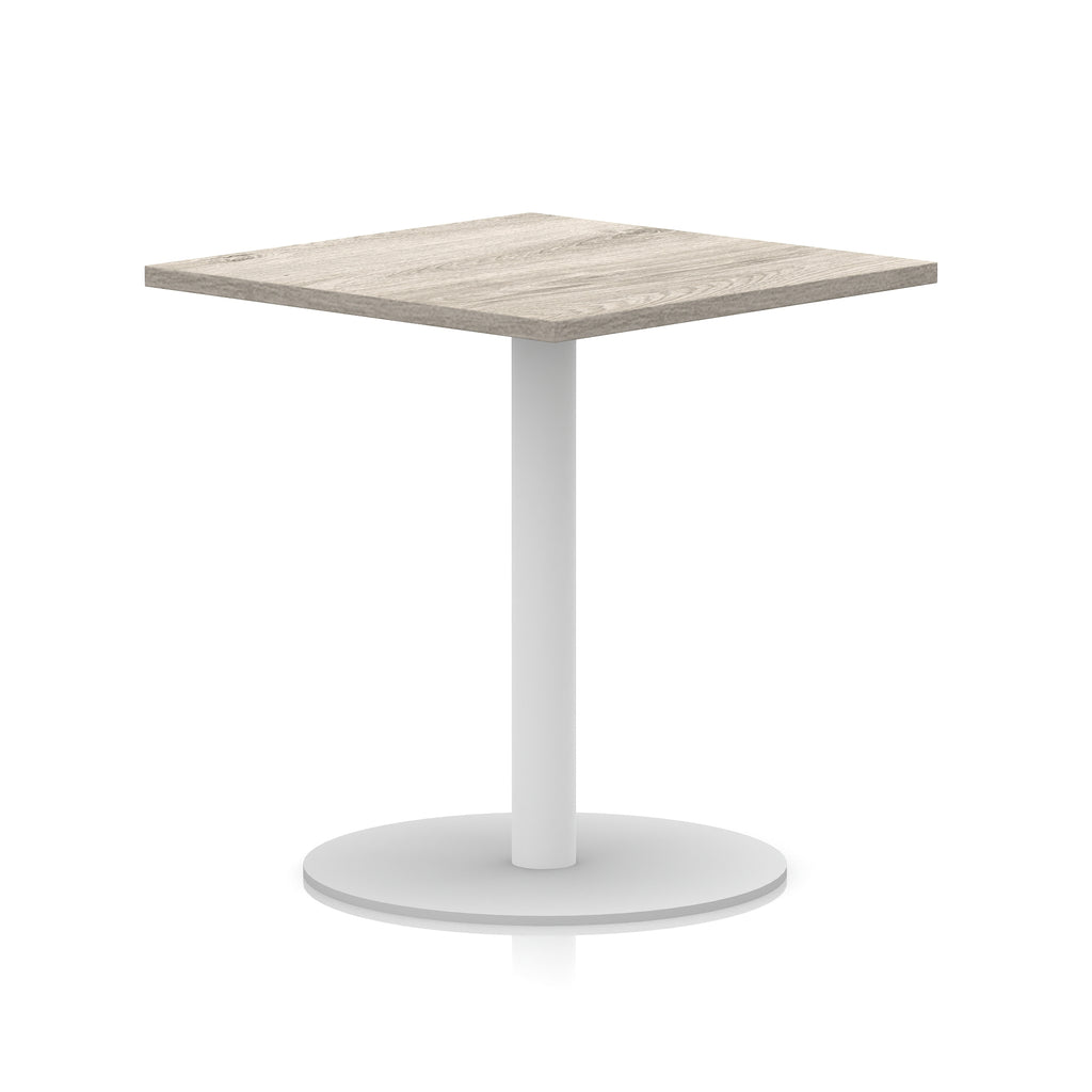 Square table with wood-effect top and white round base on a white background