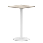 Square table with wood-effect top and white round base on a white background