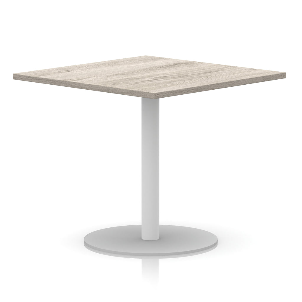 Square table with wood-effect top and white round base on a white background