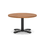 Round coffee table with wood-effect top and black metal base on a white background
