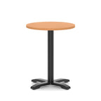 Round table with a grey wood-effect top and black base on a white background