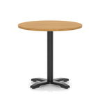 Round table with a wood-effect top and black base on a white background