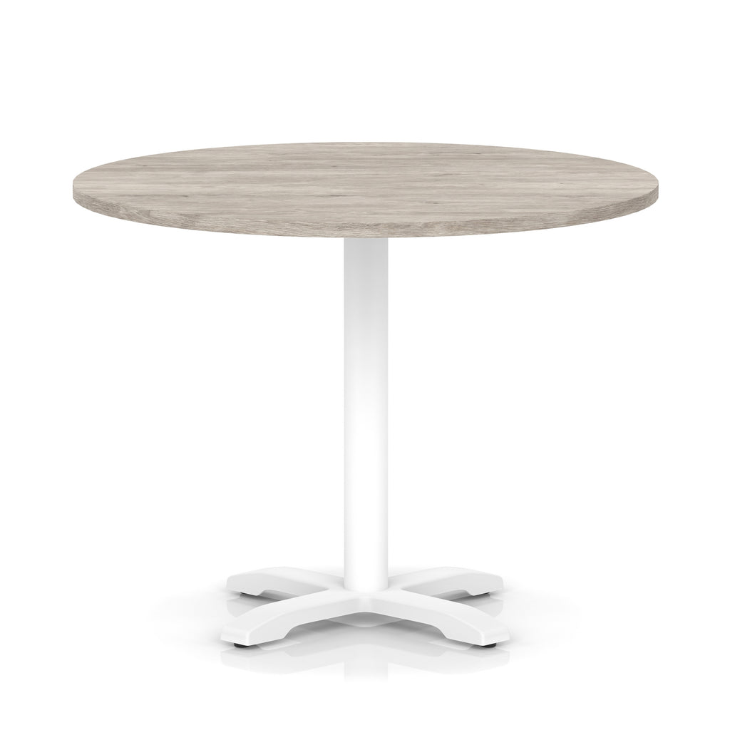 Round table with grey wood-effect top and white base on a white background