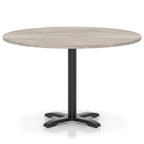 Round table with a grey wood-effect top and black base on a white background