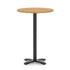 Round high table with a wood-effect top and black base on a white background