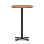Round high table with a wood-effect top and black base on a white background