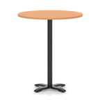 Round high table with a grey wood-effect top and black base on a white background