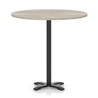Round high table with a grey wood-effect top and black base on a white background