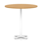 Round high table with wood-effect top and white base on a white background