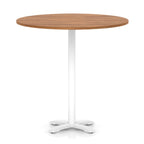 Round high table with wood-effect top and white base on a white background