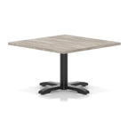 Square coffee table with grey wood-effect top and black metal base on a white background