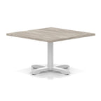 Square coffee table with grey wood-effect top and white metal base on a white background