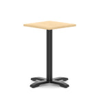 Square table with wood-effect top and black metal base on a white background