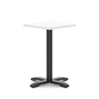 White high table with a black metal base on a white background
