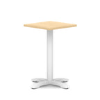 Square table with wood-effect top and white metal base on a white background